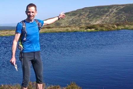 Colin Meek at the start of his challenge on the England-Scotland border Colin Meek at the start of his challenge on the England-Scotland border