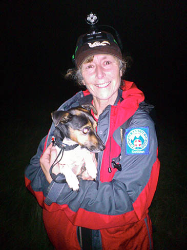 Pip with a rescuer. Photo: Coniston MRT