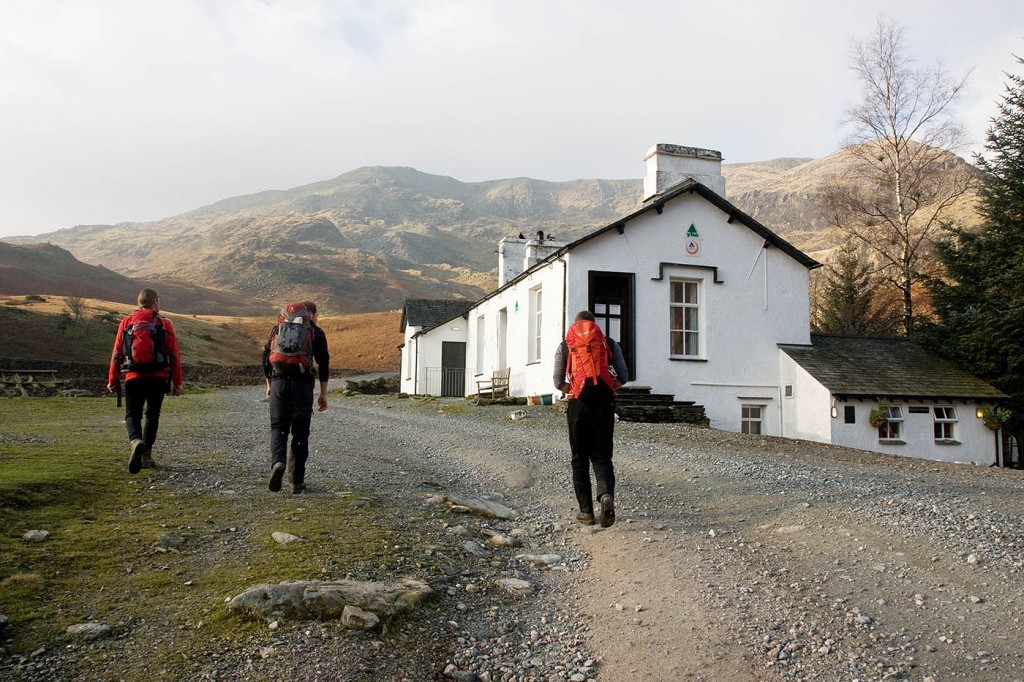 Walkers pass the youth hostel in Coppermines Valley, with the Old Man in the distance