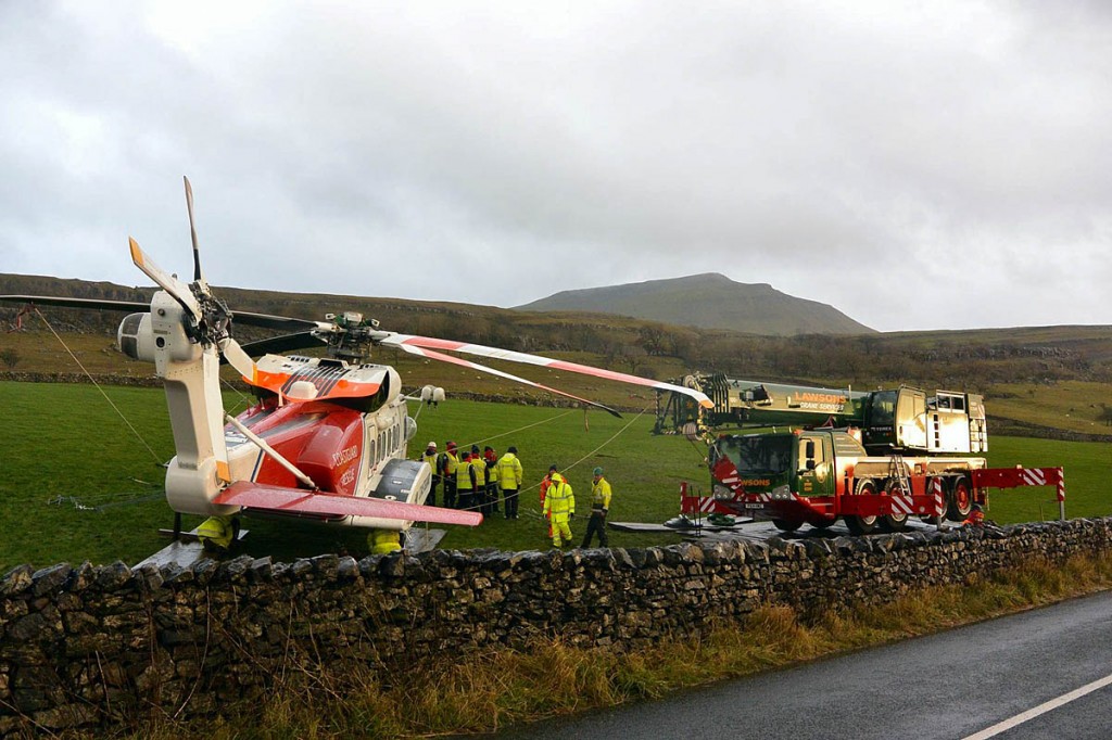 The stricken helicopter, with Ingleborough in the distance. Photo: Thomas Beresford The stricken helicopter, with Ingleborough in the distance. Photo: Thomas Beresford
