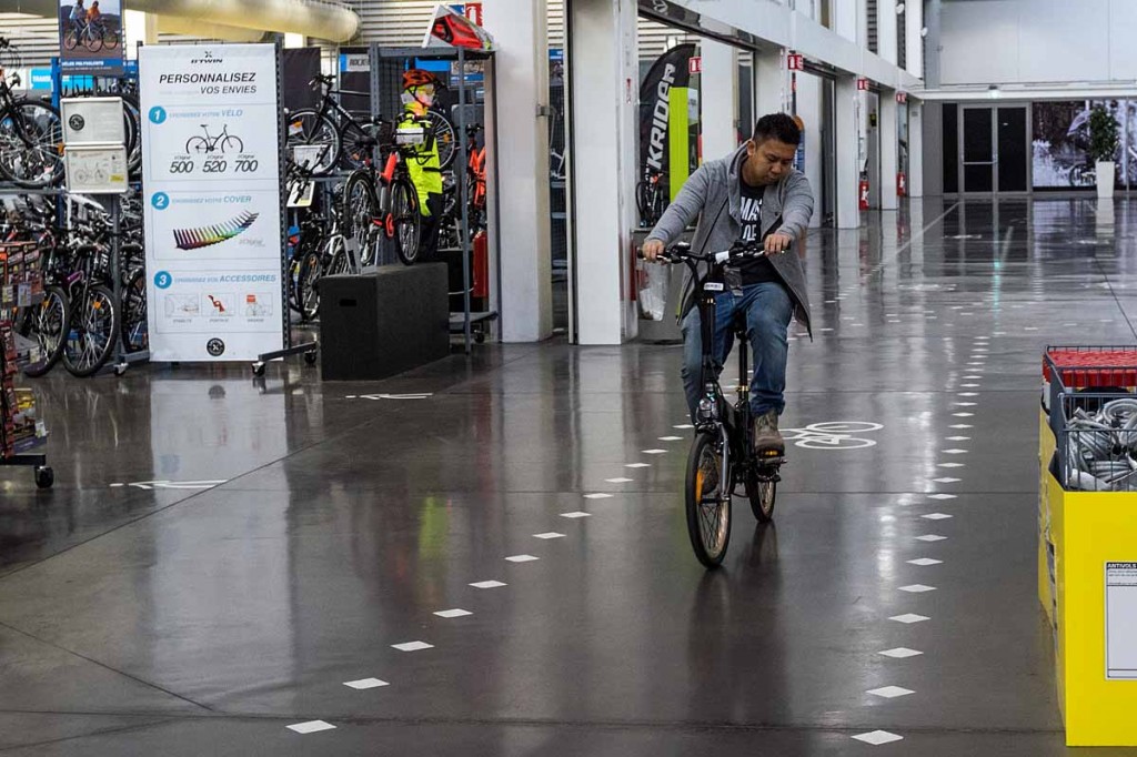 The b'Twin Village store has cycle lanes in it for customers to try before they buy, in this case an electric bike