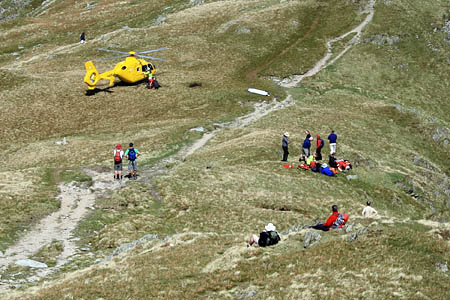 The air ambulance and rescuers at Deepdale Hause. Photo: Dawn Dick The air ambulance and rescuers at Deepdale Hause. Photo: Dawn Dick
