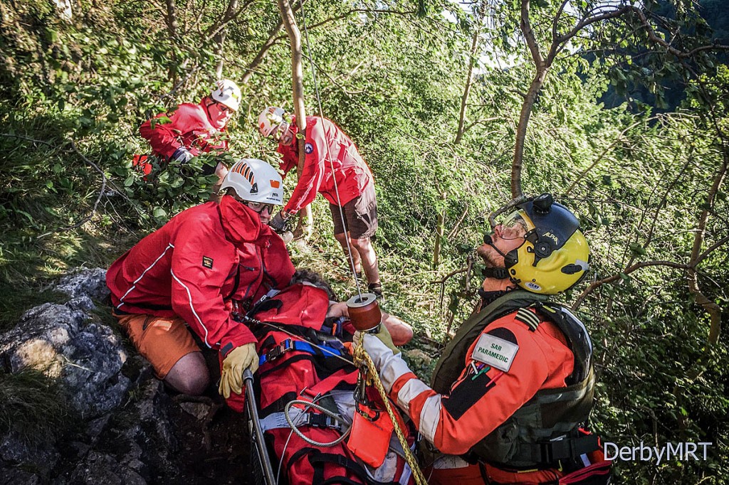 Rescue team members and Coastguard crew prepare to winch the injured man. Photo: Derby MRT0 Rescue team members and Coastguard crew prepare to winch the injured man. Photo: Derby MRT