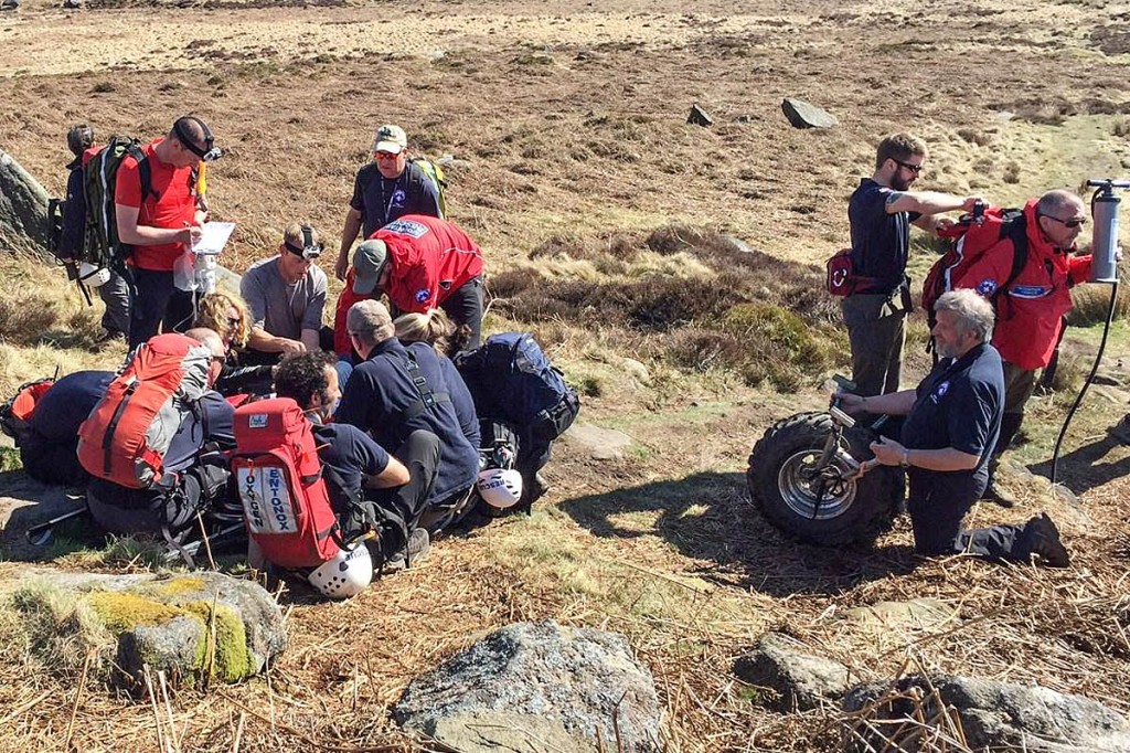 Edale Mountain Rescue Team members treat the walker at the scene. Photo: Edale MRT Edale Mountain Rescue Team members treat the walker at the scene. Photo: Edale MRT