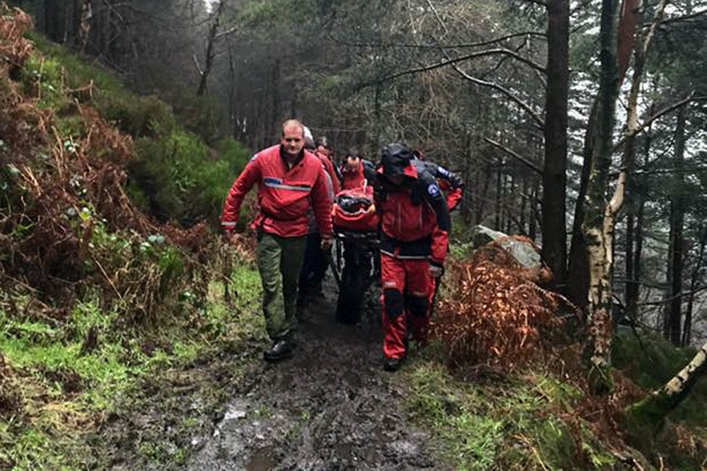 Rescue team members stretcher the injured rider from the woods. Photo: Edale MRT Rescue team members stretcher the injured rider from the woods. Photo: Edale MRT