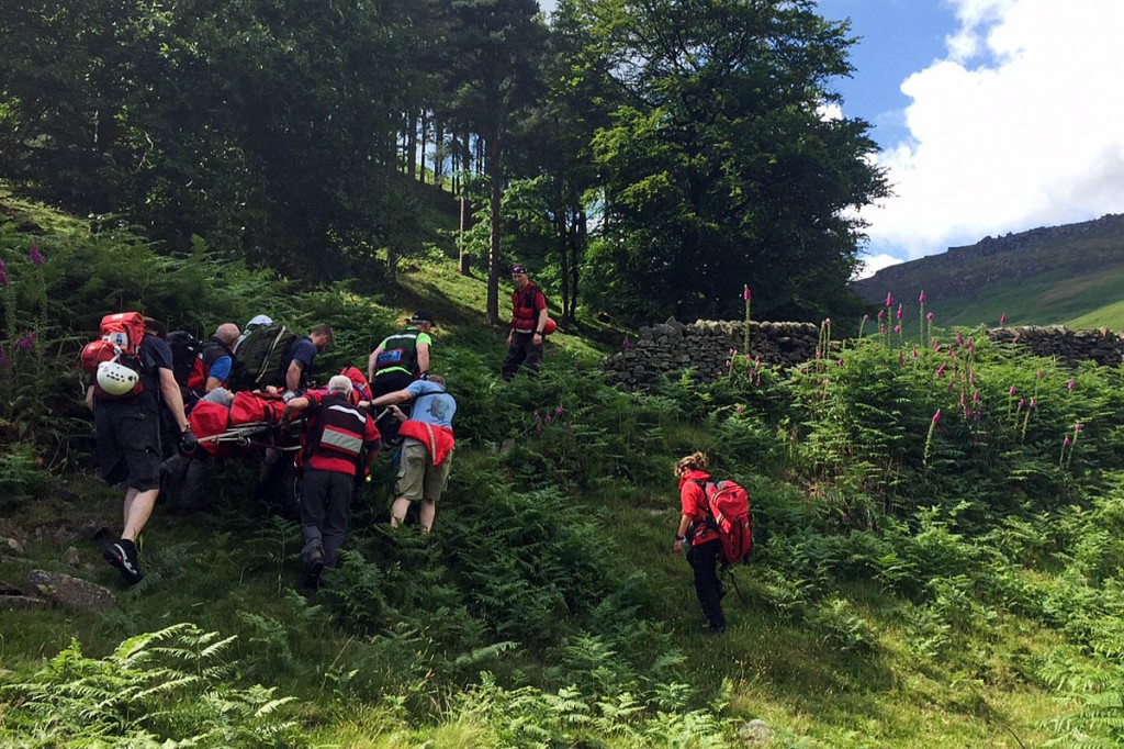 The Burbage North climber is stretchered from the crag after his fall. Photo: Edale MRT