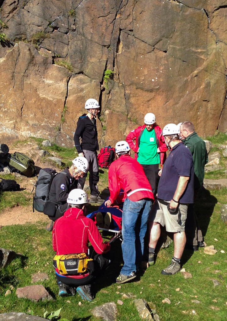 Team members at the site of the climbing fall at Lawrence Field. Photo: Edale MRT
