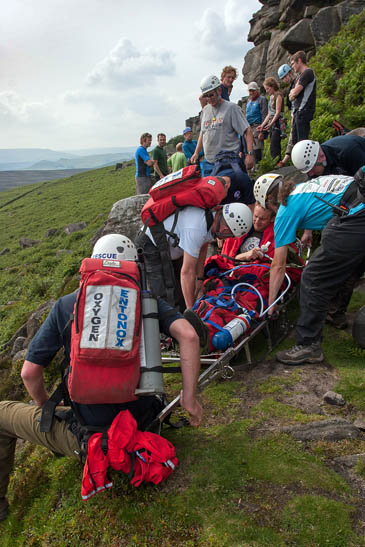 Edale MRT members treat the second climber on Stanage Edge. Photo: Edale MRT Edale MRT members treat the second climber on Stanage Edge. Photo: Edale MRT