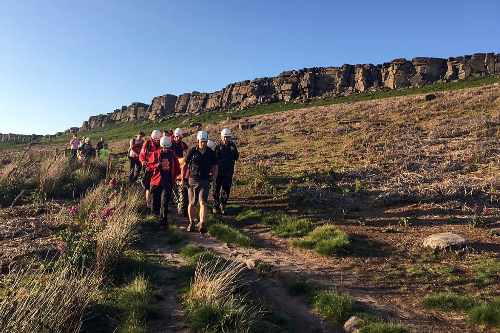 Edale team members stretcher the walker from Stanage Edge. Photo: Edale MRT Edale team members stretcher the walker from Stanage Edge. Photo: Edale MRT