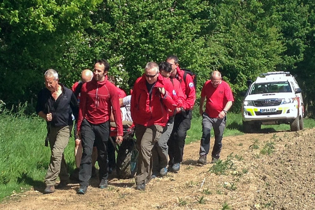 Rescuers stretcher the injured man from the site at Wigley. Photo: Edale MRT