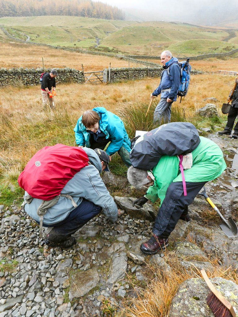 Volunteers work on repairing footpaths Volunteers work on repairing footpaths