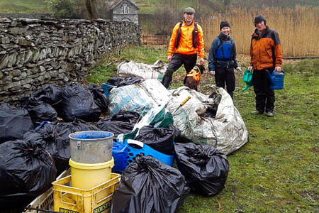 Volunteers with some of the rubbish, including watering cans Volunteers with some of the rubbish, including watering cans
