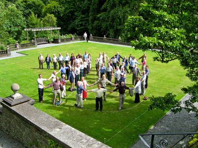 Party guest mark out the number 75 on the lawn of Rydal Hall