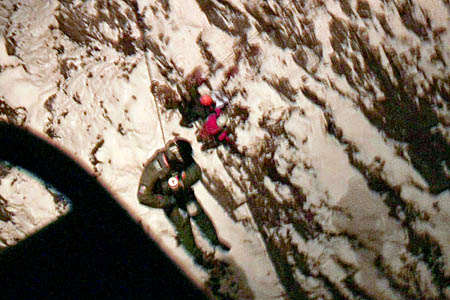 Winchman Taff Ashman is lowered to two of the walkers Winchman Taff Ashman is lowered to two of the walkers