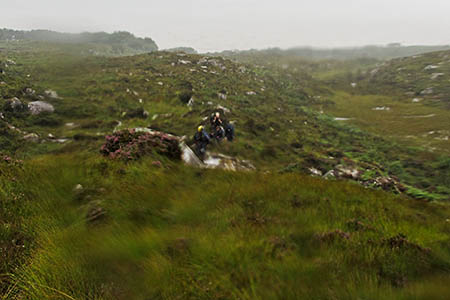 The group of five being led back to the helicopter across the sodden hillside. Photo: Royal Navy The group of five being led back to the helicopter across the sodden hillside. Photo: Royal Navy