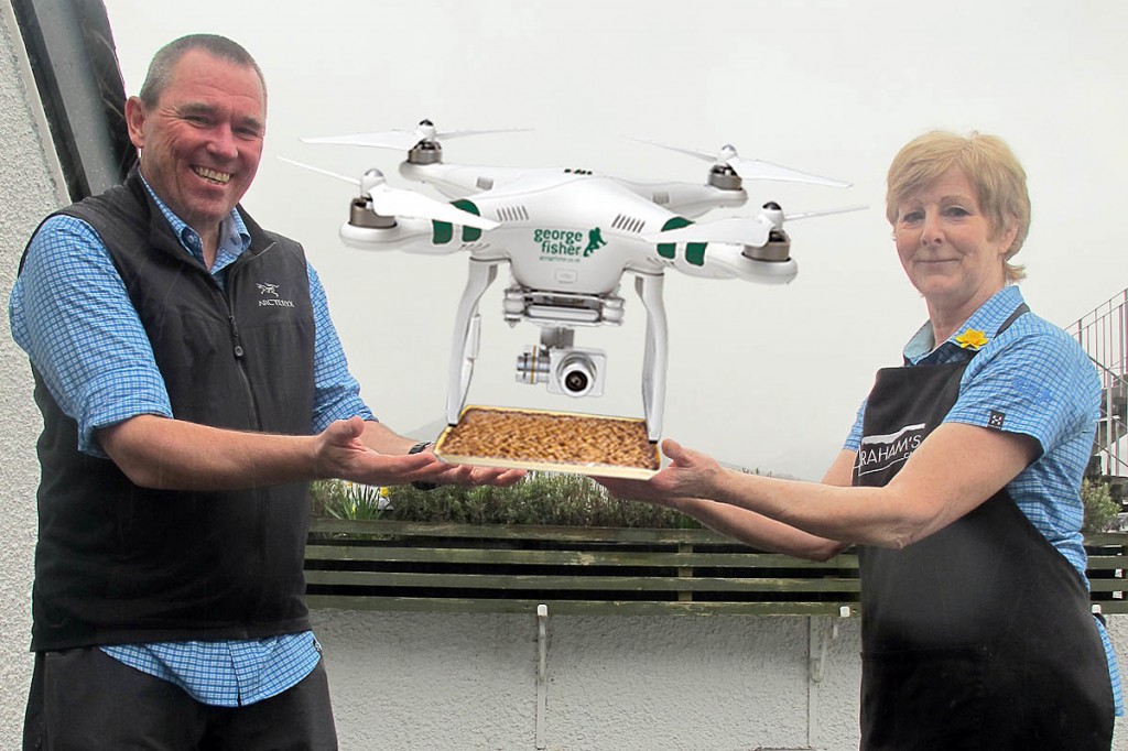 Andy Airey and Jan from Abrahams Cafe prepare the delivery drone Andy Airey and Jan from Abrahams Cafe prepare the delivery drone