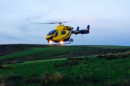 The police helicopter flew the walker to hospital after she suffered chest pains near Glossop The police helicopter flew the walker to hospital after she suffered chest pains near Glossop