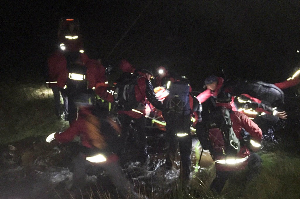 Rescuers stretcher the injured walker across a Shelf Brook. Photo: Glossop MRT Rescuers stretcher the injured walker across a Shelf Brook. Photo: Glossop MRT