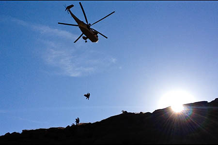 The injured woman is winched into the Sea King from Fairbrook. Photo: Glossop MRT The injured woman is winched into the Sea King from Fairbrook. Photo: Glossop MRT