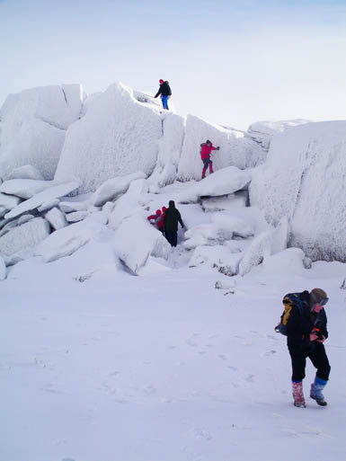 Conditions such as these enjoyed by walkers on Glyder Fach will deteriorate as the thaw continues. Photo: Far Closer CC-BY-2.0