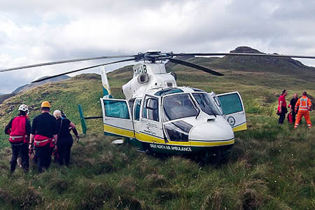 Rescuers in action on the fells above Angle Tarn. Photo: GNAA Rescuers in action on the fells above Angle Tarn. Photo: GNAA