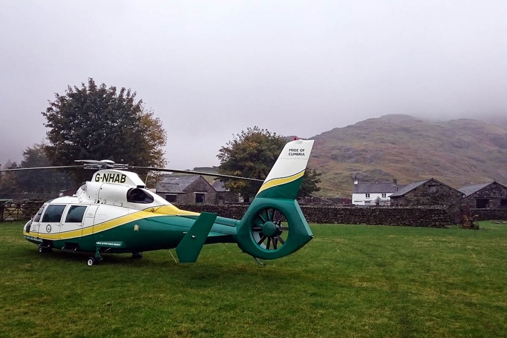 The air ambulance at the incident in Great Langdale, with The Band in the background. Photo: GNAAS