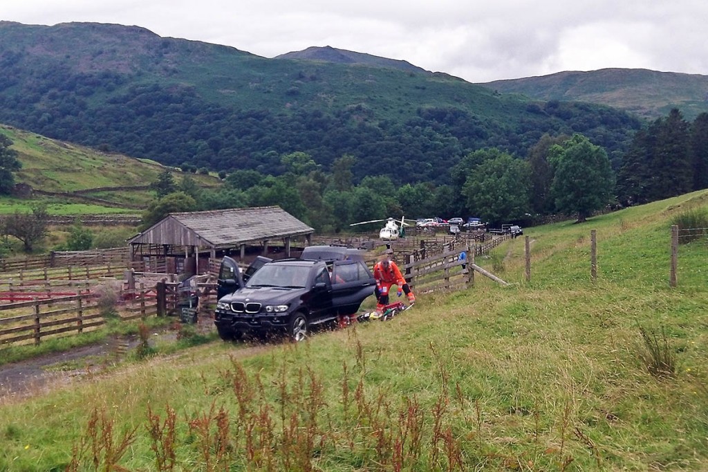 Rescuers and air ambulance crew members at the site at Hartsop. Photo: GNAAS