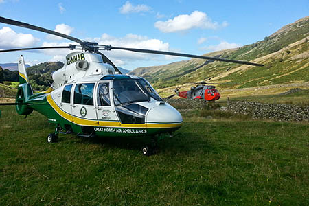 The Great North Air Ambulance and the Royal Navy Sea King after returning to the valley. Photo: GNAAS The Great North Air Ambulance and the Royal Navy Sea King after returning to the valley. Photo: GNAAS