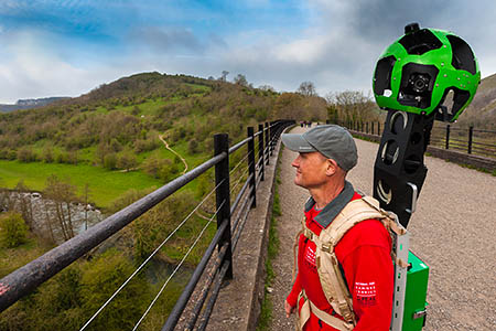 A Peak District national park ranger with Google Trekker backpack on the Monsal Viaduct. A Peak District national park ranger with Google Trekker backpack on the Monsal Viaduct.