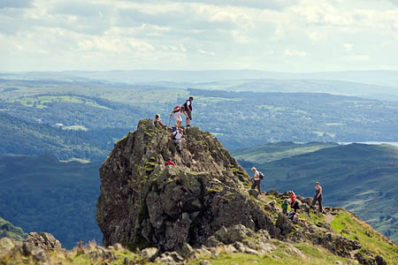 Visitors in the Lake District, one of the parks facing cuts of 28 per cent Visitors in the Lake District, one of the parks facing cuts of 28 per cent