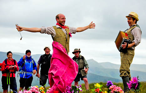 Jem Famous and Campbell Innes perform for walkers on High Street's summit. Photo: Stewart Smith Jem Famous and Campbell Innes perform for walkers on High Street's summit. Photo: Stewart Smith