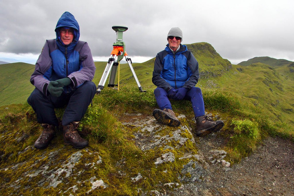 Graham Jackson and John Barnard beside the Leica GS15 at the summit of Creag na Caillich which until their survey was classified as a munro top. Photo: Myrddyn Phillips