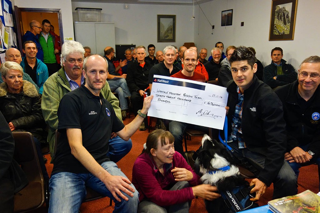 Adam Nolan and Jasper hand over the cheque to Wasdale MRT