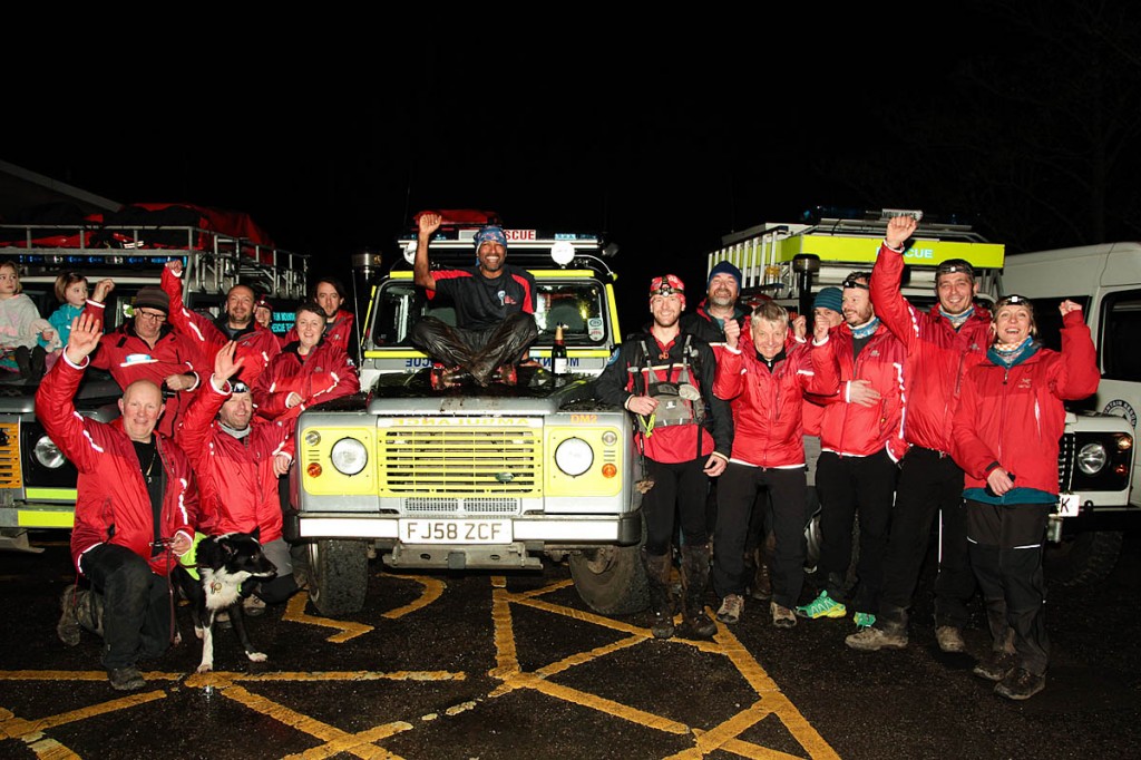 Javed Bhatti celebrates with mountain rescue team members after finishing at Edale. Photo: John Bamber