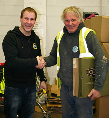 One of the first recipients collects his boots from Matt Hill of Keen footwear at the Bridgwatwer flood relief distribution centre. Photo: Keen One of the first recipients collects his boots from Matt Hill of Keen footwear at the Bridgwatwer flood relief distribution centre. Photo: Keen