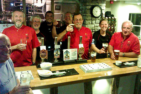 Kendal Mountain Rescue Team members raise a glass to the Mountain Medicine special brew Kendal Mountain Rescue Team members raise a glass to the Mountain Medicine special brew
