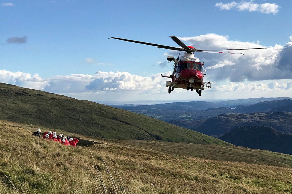 The Coastguard helicopter with rescue team members at the site. Photo: Keswick MRT The Coastguard helicopter with rescue team members at the site. Photo: Keswick MRT