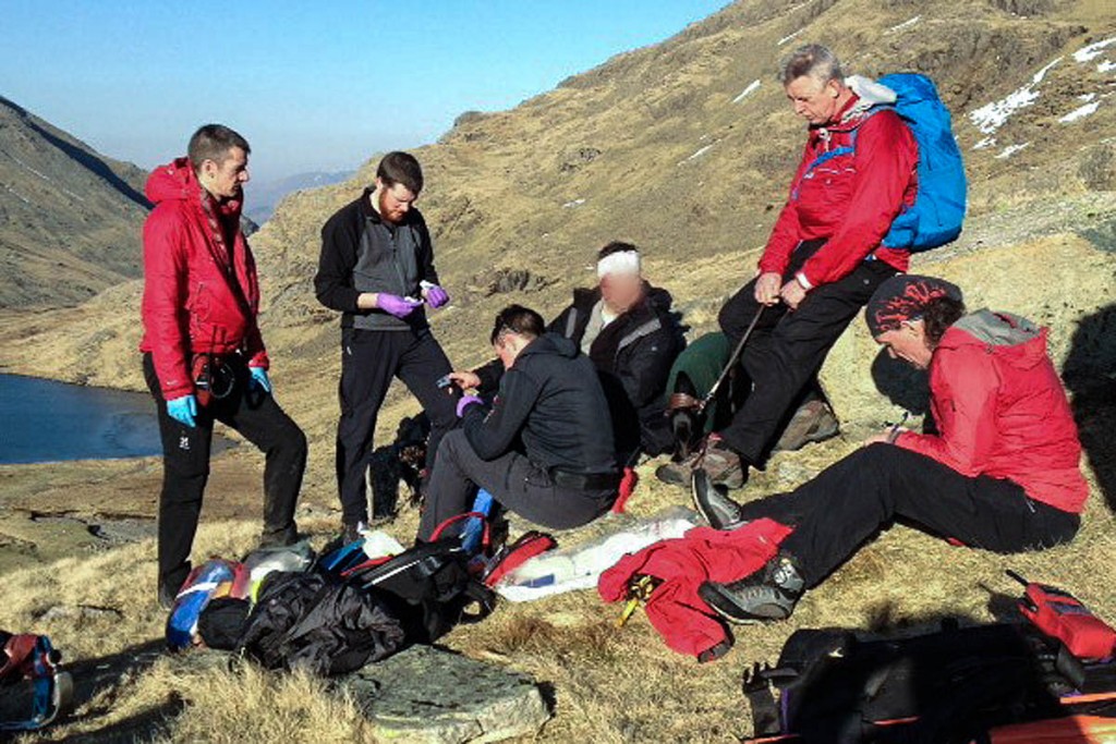 Rescuers with the injured walker. Photo: Keswick MRT