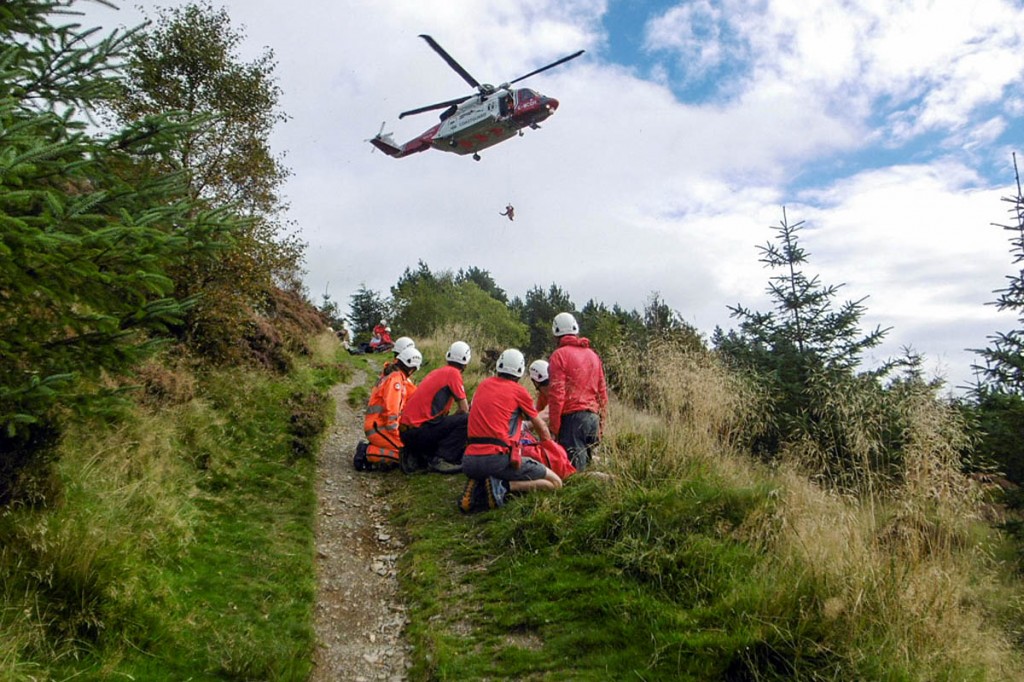 Rescuers and the Coastguard helicopter at the scene on Dodd. Photo: Keswick MRT