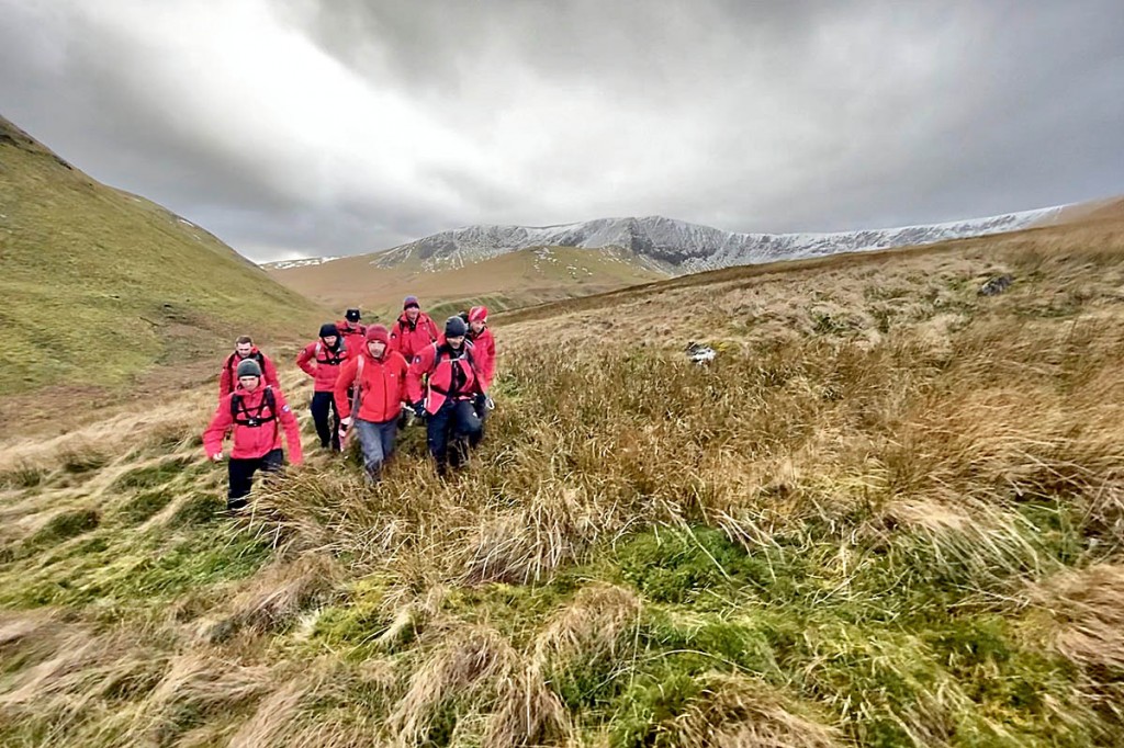 Rescuers stretcher the injured walker from the fell. Photo: Keswick MRT Rescuers stretcher the injured walker from the fell. Photo: Keswick MRT