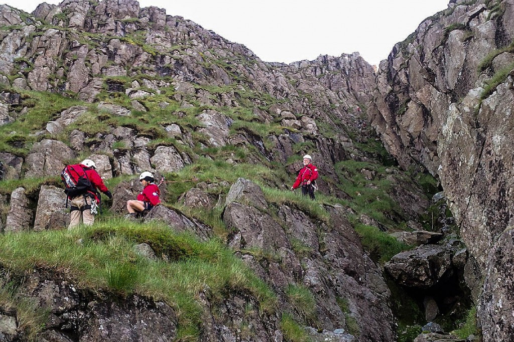 Rescuers help lower the stranded climbers to safety. Photo: Keswick MRT