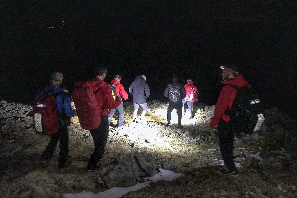 Rescuers lead the lost walkers to safety. Photo: Keswick MRT Rescuers lead the lost walkers to safety. Photo: Keswick MRT