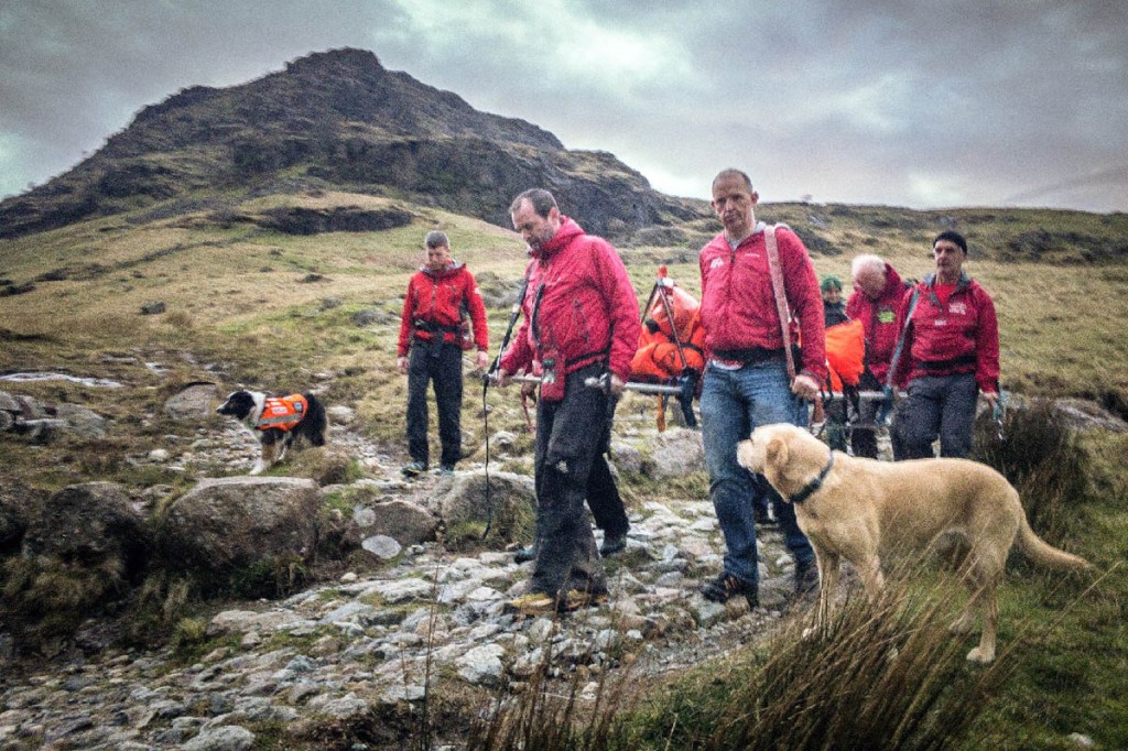 Rescuers stretcher the injured walker from the fell. Photo: Keswick MRT Rescuers stretcher the injured walker from the fell. Photo: Keswick MRT