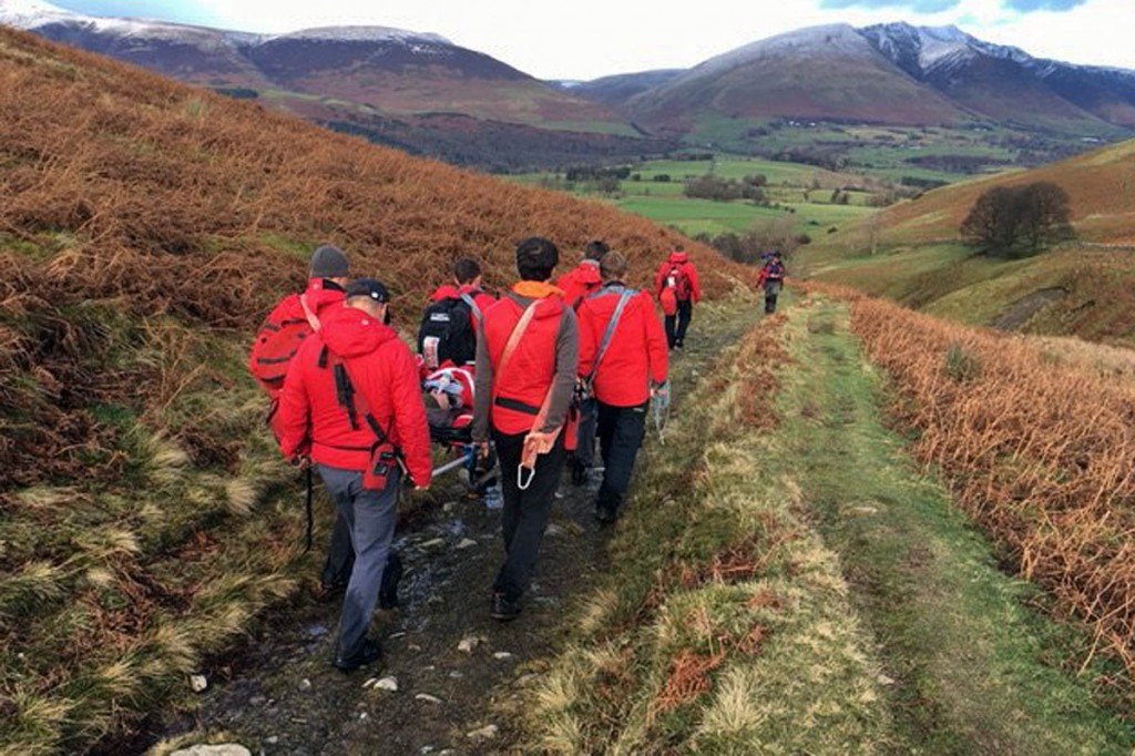 Rescuers stretcher the injured woman from the fell. Photo: Keswick MRT Rescuers stretcher the injured woman from the fell. Photo: Keswick MRT
