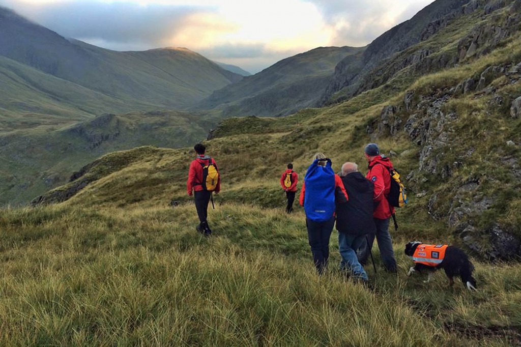 Keswick team members help the walkers to safety from Sty Head. Photo: Keswick MRT