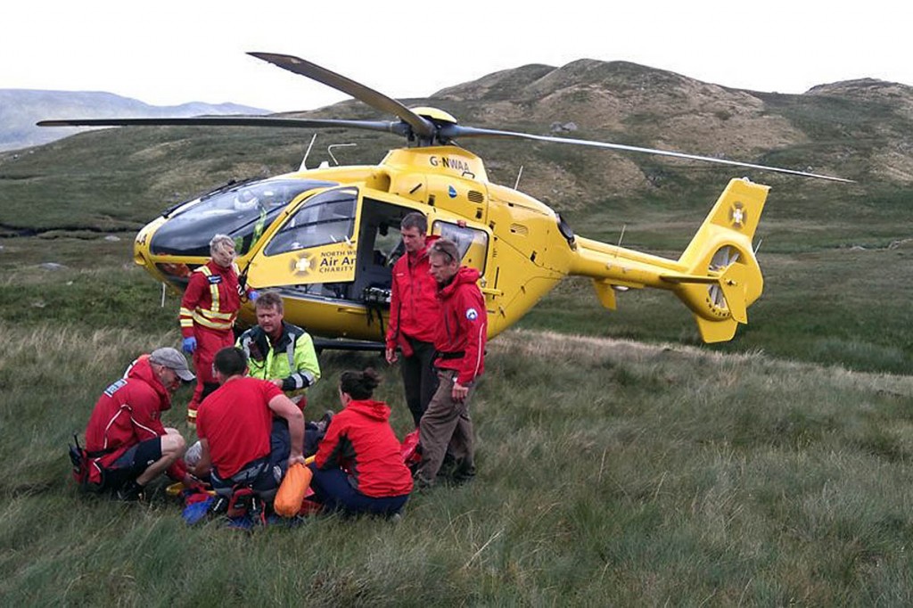 Rescuers and the air ambulance crew at the scene near Greenup Edge. Photo: Keswick MRT