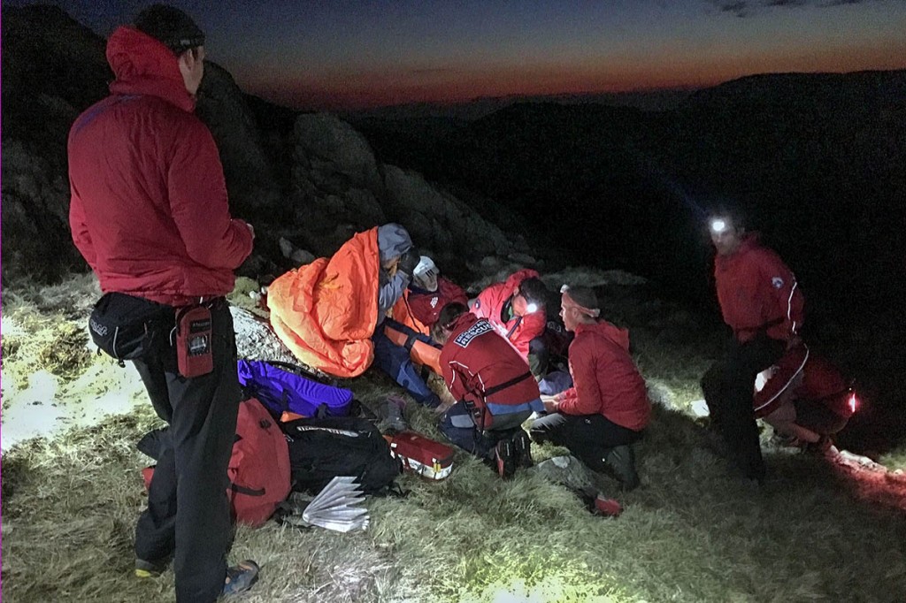 Team member attend to the injured woman. Photo: Keswick MRT Team member attend to the injured woman. Photo: Keswick MRT