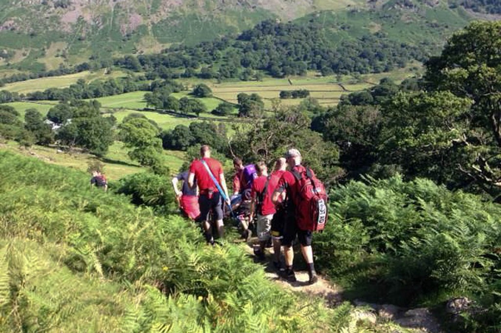 Rescuers stretcher the walker from the Allerdale Ramble route. Photo: Keswick MRT