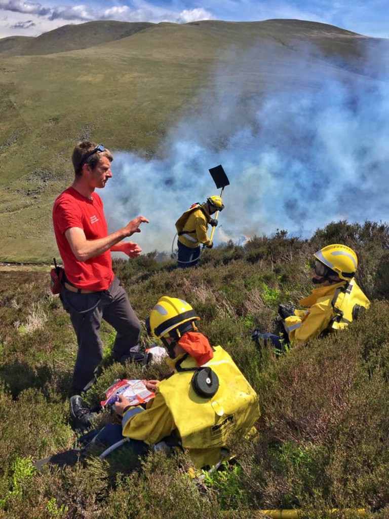 Firefighters used beaters and water-carrying backpacks to tackle the blaze. Photo: Keswick MRT