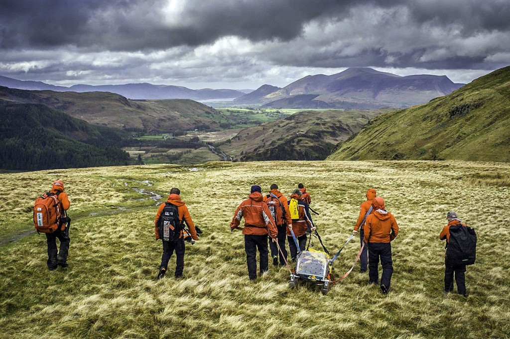 The team stretchers the injured walker from Sticks Pass. Photo: Keswick MRT The team stretchers the injured walker from Sticks Pass. Photo: Keswick MRT
